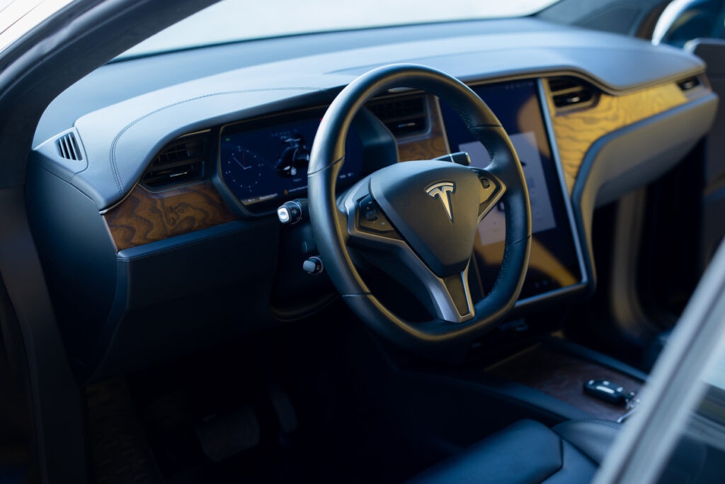 electric car tesla model x high tech modern development robotic car of the future interior of tesla model x electric car with large touch screen dashboard, wheel. Tesla Autopilot crash lawyer.